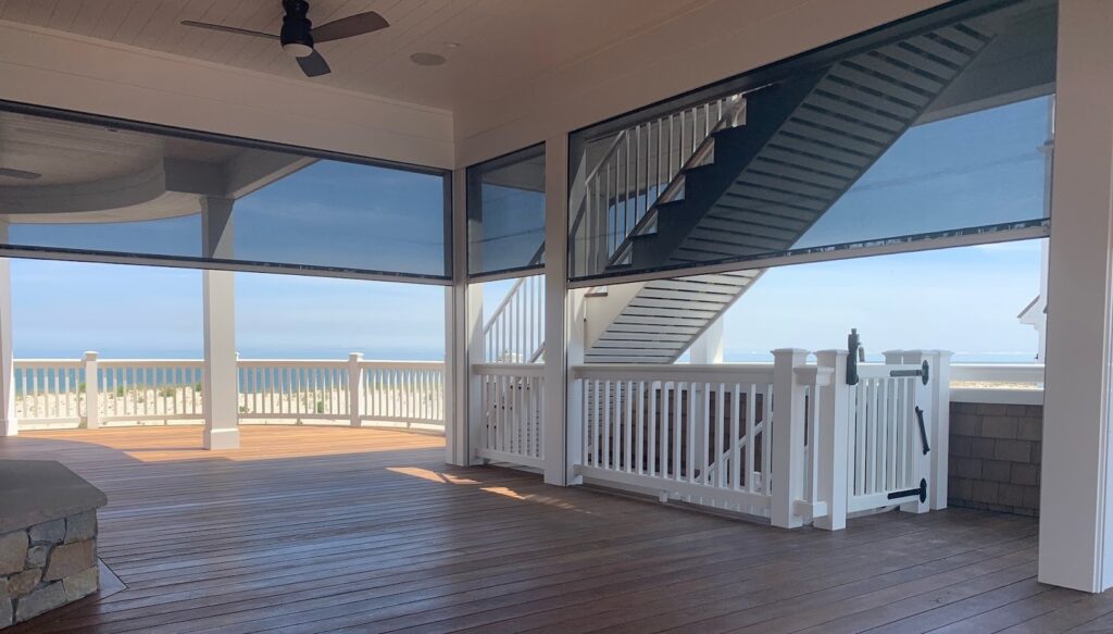 Interior view of South Carolina beach house looking out onto the lake through Sunesta interior roller shades